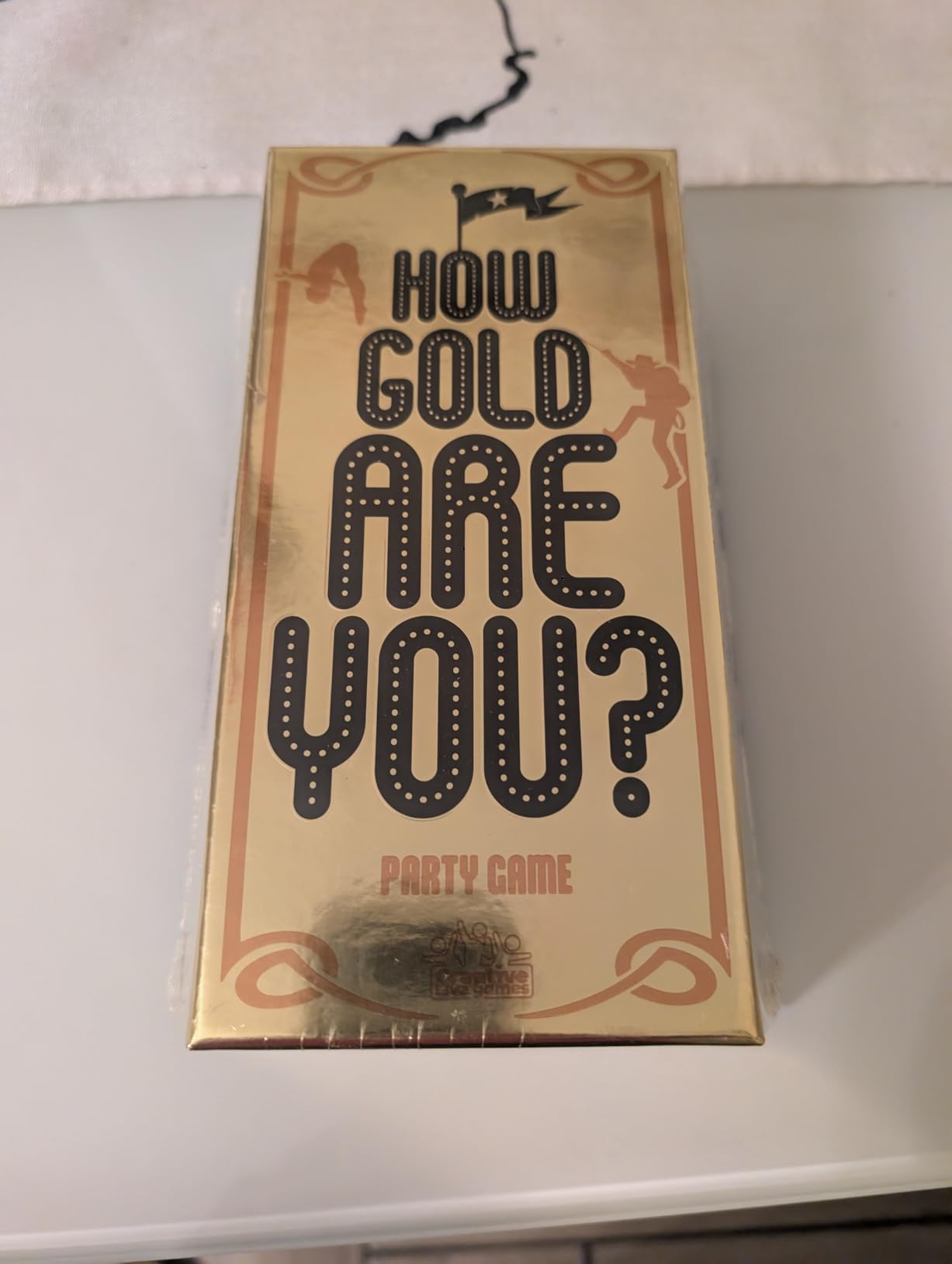 Asmodee How Gold Are You? gioco di bluff 3-6 giocatori
